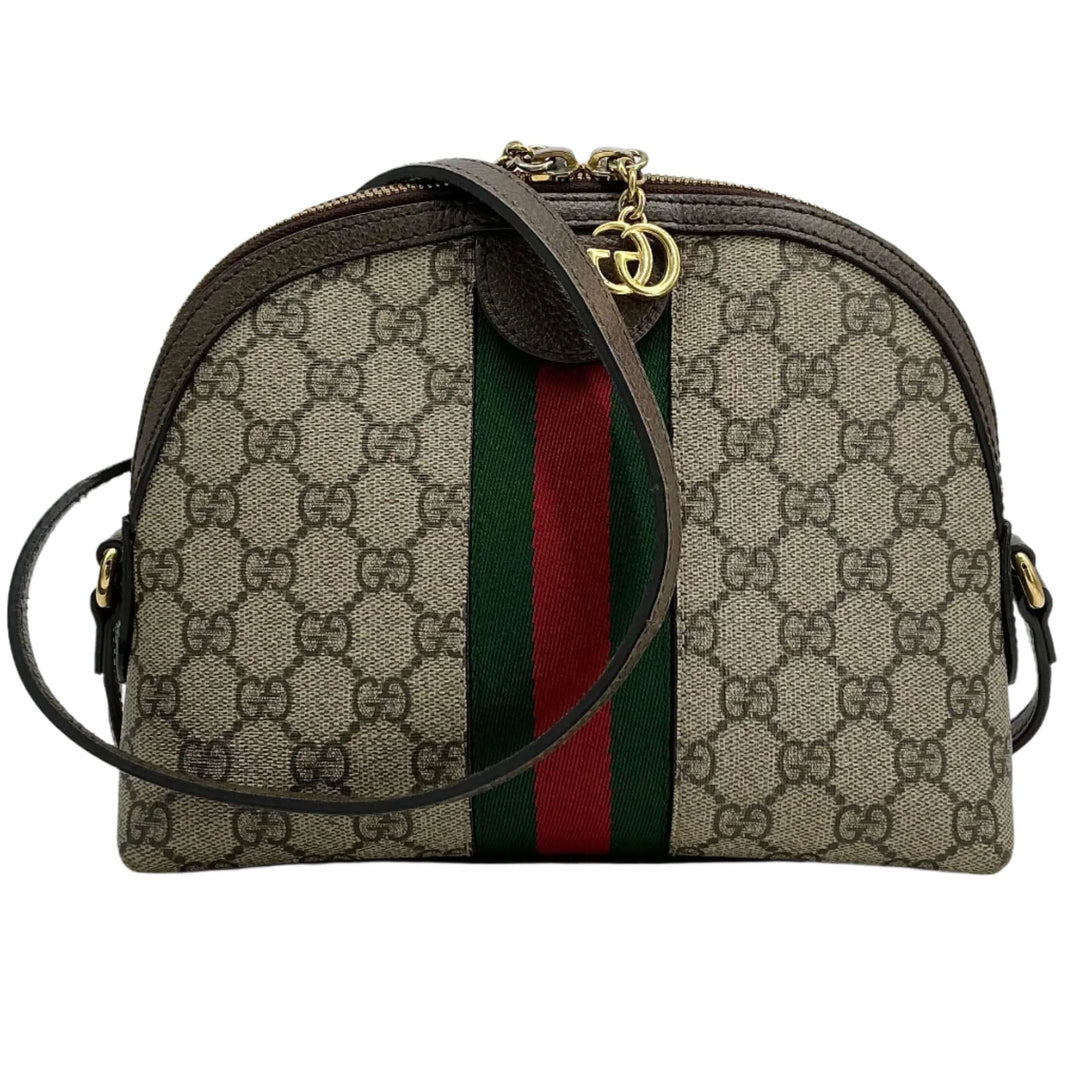 Gucci GG Supreme dome shoulder bag featuring iconic green and red Web stripe and gold-tone Double G charms.