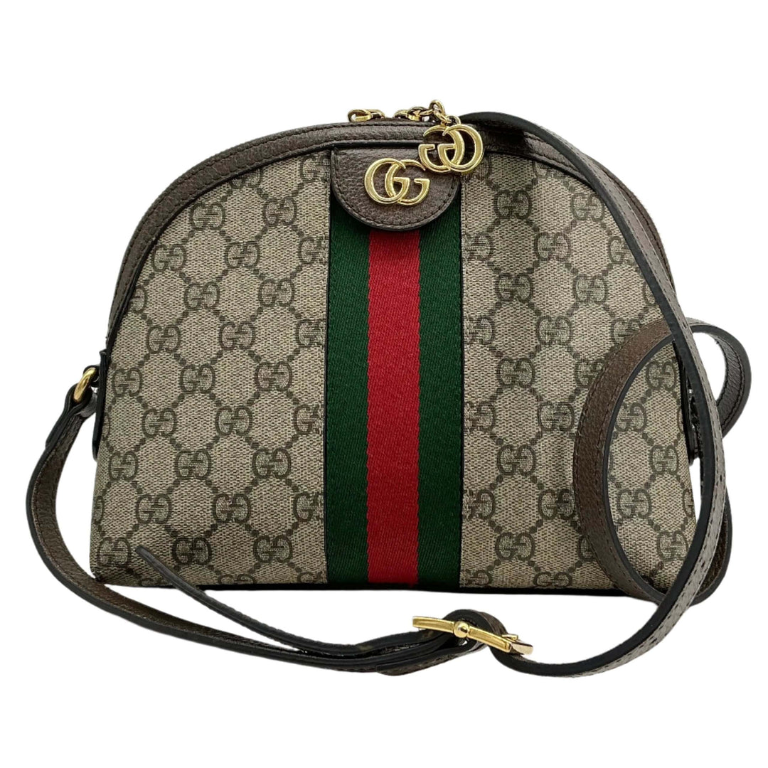Gucci GG Supreme Dome Shoulder Bag featuring Web Stripe and Double G Charms, showcasing vintage elegance and modern design.