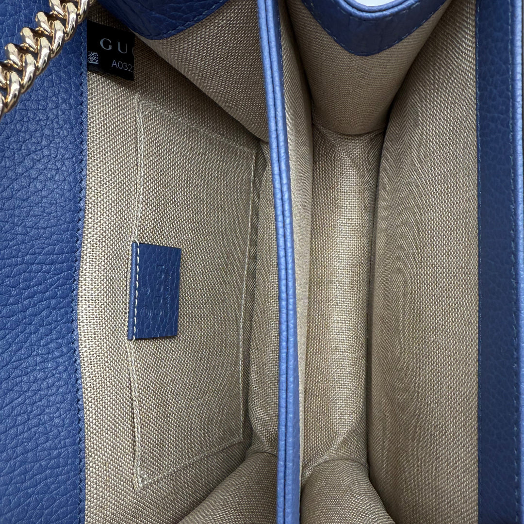 Interior view of Gucci Interlocking G Small Shoulder Bag showcasing dollar calfskin leather and ample storage.