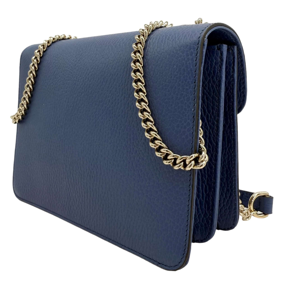 Gucci Interlocking G Small Shoulder Bag in dollar calfskin leather with gold-tone chain strap and sleek design.