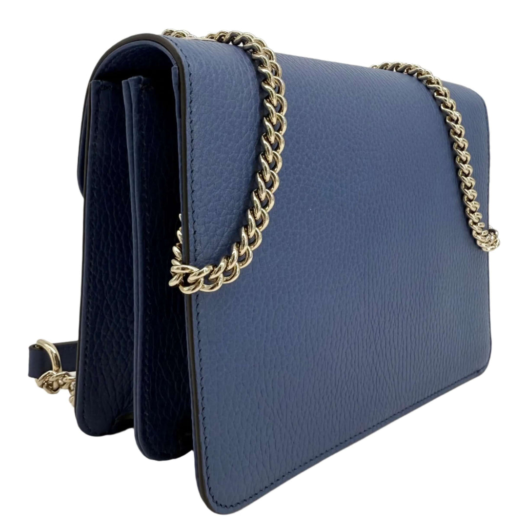 Gucci Interlocking G Small Shoulder Bag in dollar calfskin leather with gold-tone chain strap and sleek design.