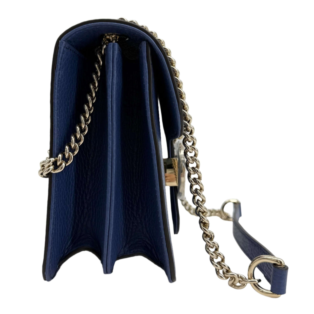 Gucci Interlocking G Small Shoulder Bag in dollar calfskin leather with light gold-tone chain strap and structured design.