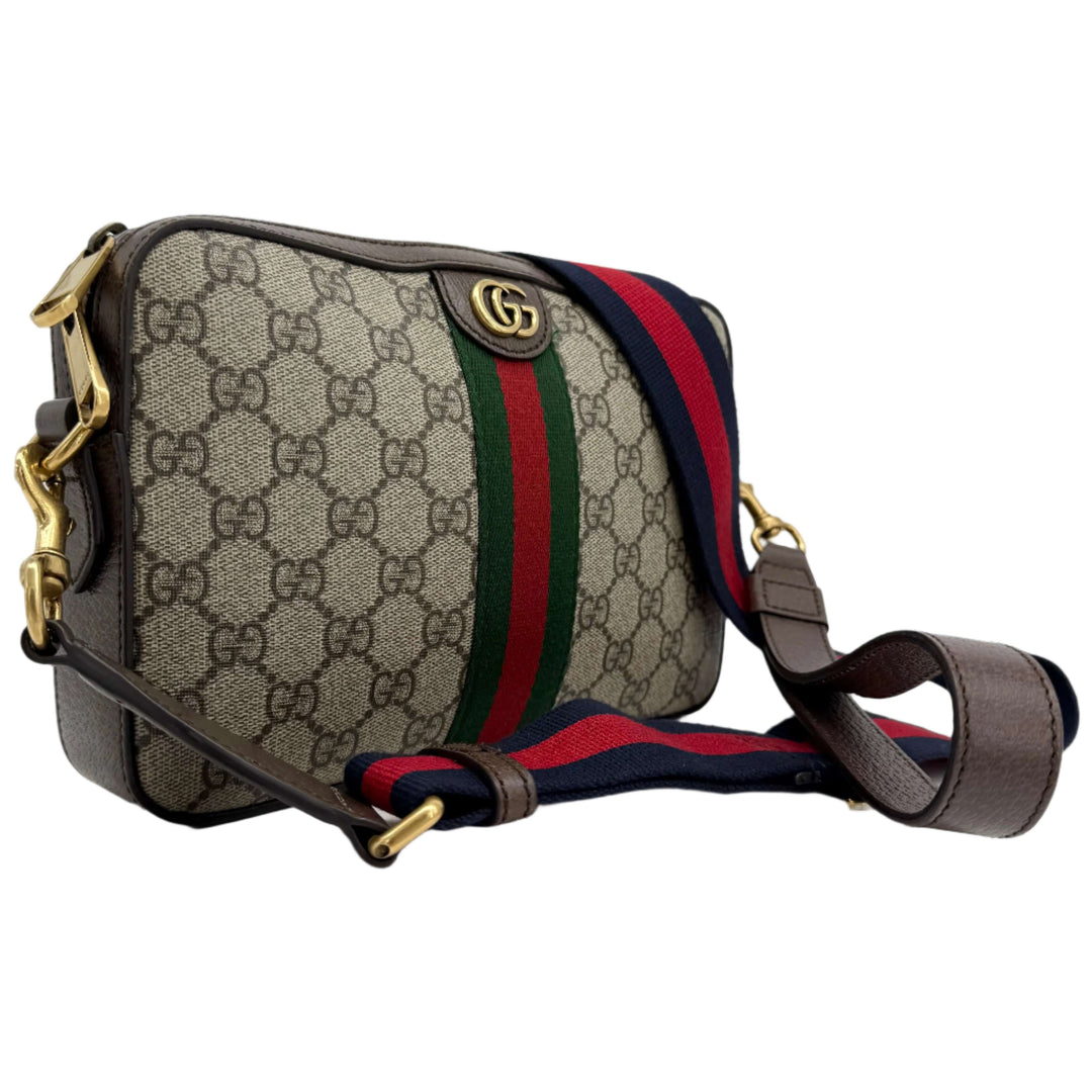 Gucci Ophidia Crossbody Bag in GG Supreme canvas with Web strap and Double G hardware, showcasing elegant design.