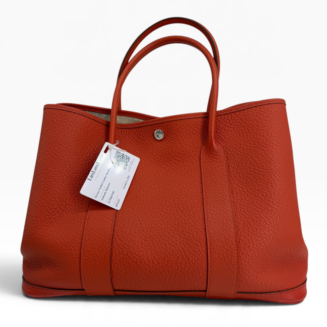 Hermès Garden Party 30 TPM Orange Poppy Negonda leather tote front with rolled handles and silver-tone snap