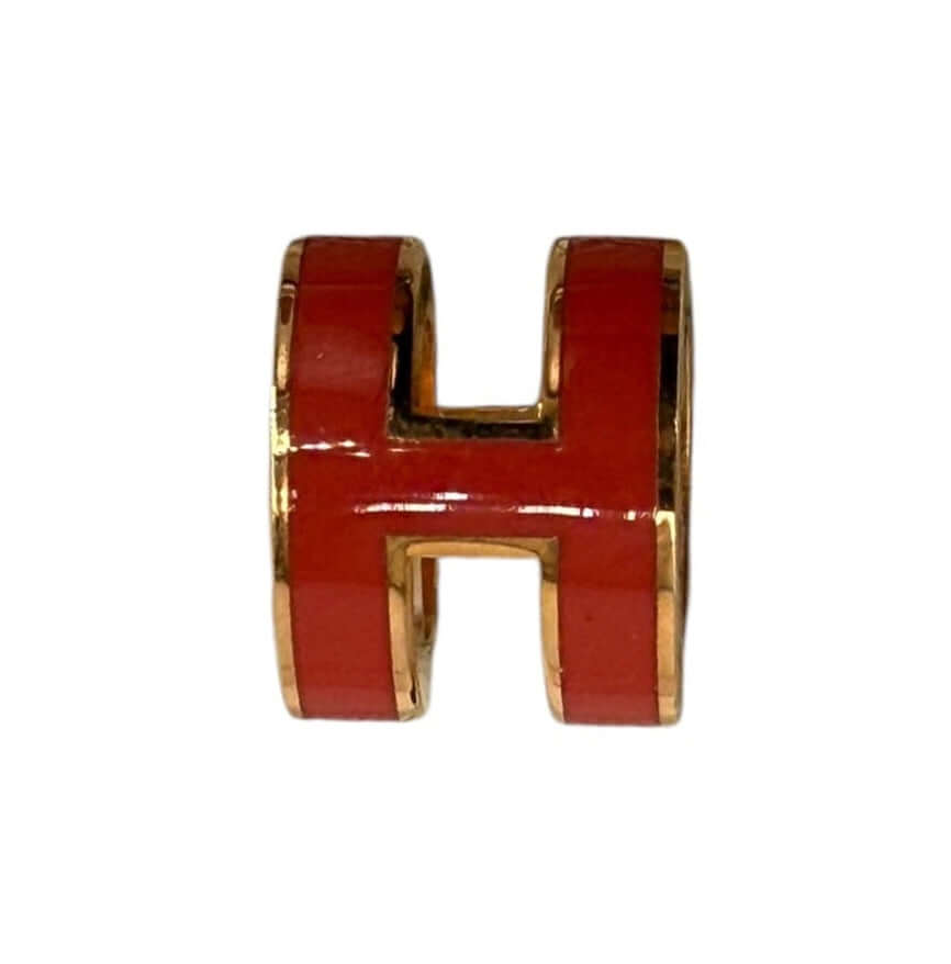 Hermès Pop H Pendant Charm – Orange Enamel & Gold-Tone Hardware, featuring iconic H design in vibrant orange.