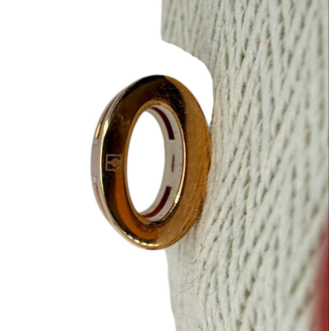 Hermès Pop H Pendant Charm – Orange Enamel & Gold-Tone Hardware close-up of gold-tone hardware detail.