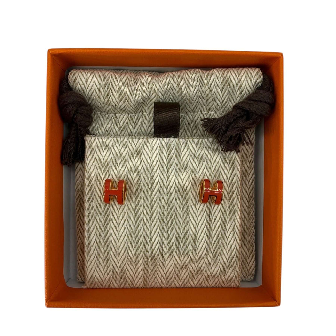Hermès Pop H Pendant Charm – Orange Enamel & Gold-Tone Hardware in elegant presentation box.