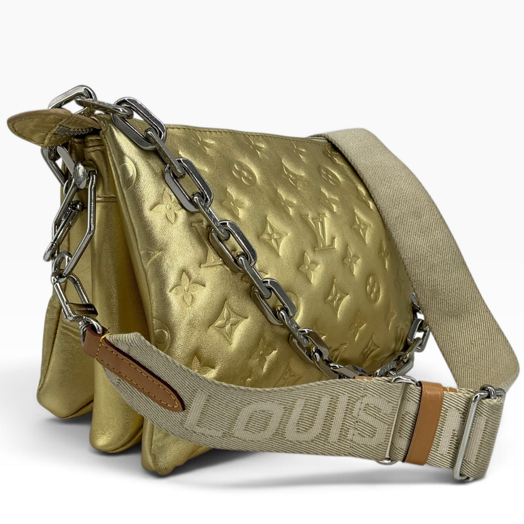 Louis Vuitton Coussin PM Gold angled front with metallic lambskin and beige textile strap