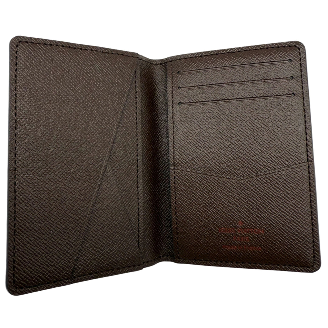 Interior view of Louis Vuitton Damier Ebene Canvas Pocket Organizer Wallet showing card slots and textured brown lining.