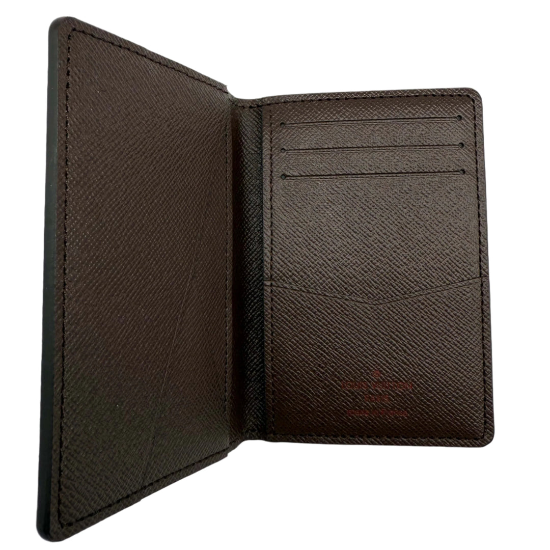 Interior view of Louis Vuitton Damier Ebene Pocket Organizer Wallet showing card slots and textured canvas.