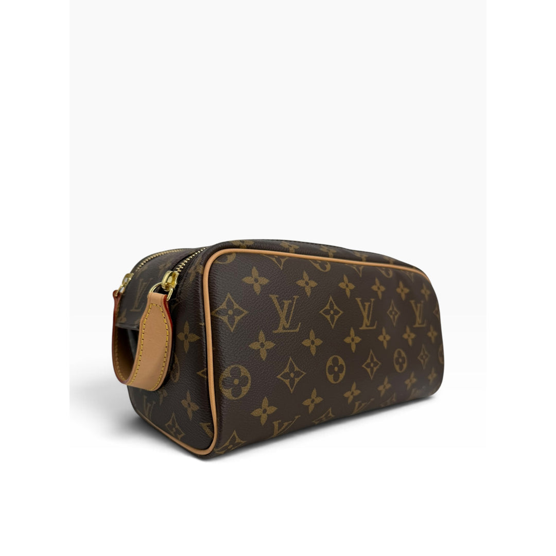 Louis Vuitton Dopp Kit M44494 side angle with vachetta trim