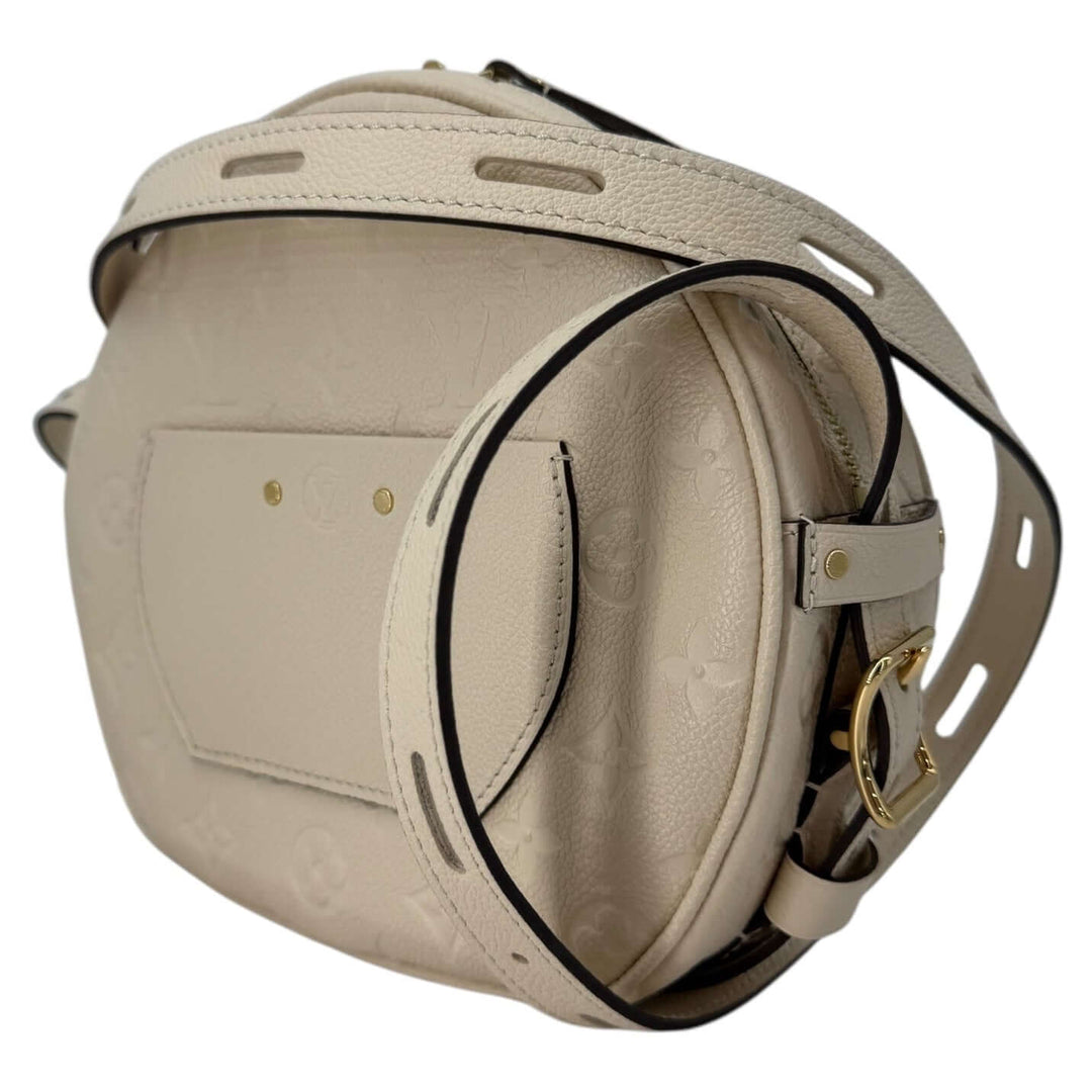 Louis Vuitton Empreinte Boîte Chapeau Souple MM – Creme side view showcasing the stylish design and details.