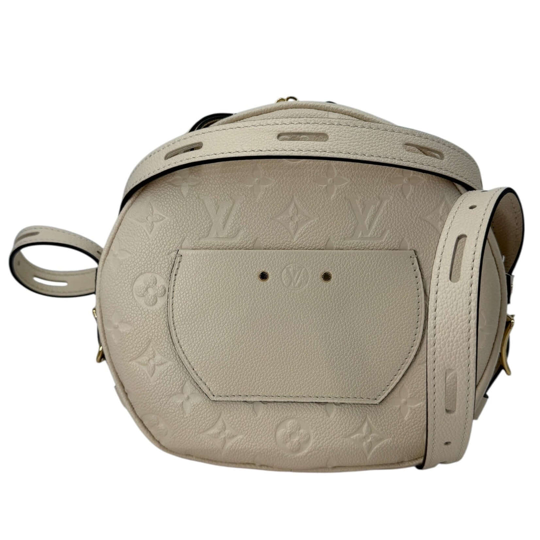 Louis Vuitton Empreinte Boîte Chapeau Souple MM – Creme bag showing the back side and strap detail.