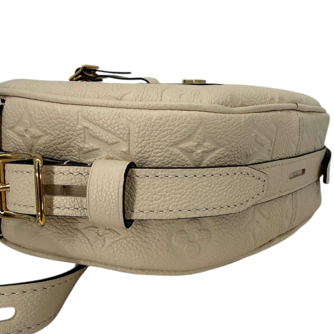 Louis Vuitton Empreinte Boîte Chapeau Souple MM – Creme leather bag side view showcasing the embossed design.