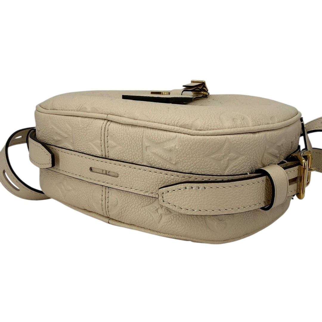 Louis Vuitton Empreinte Boîte Chapeau Souple MM – Creme, stylish cream leather bag with embossed logo design.