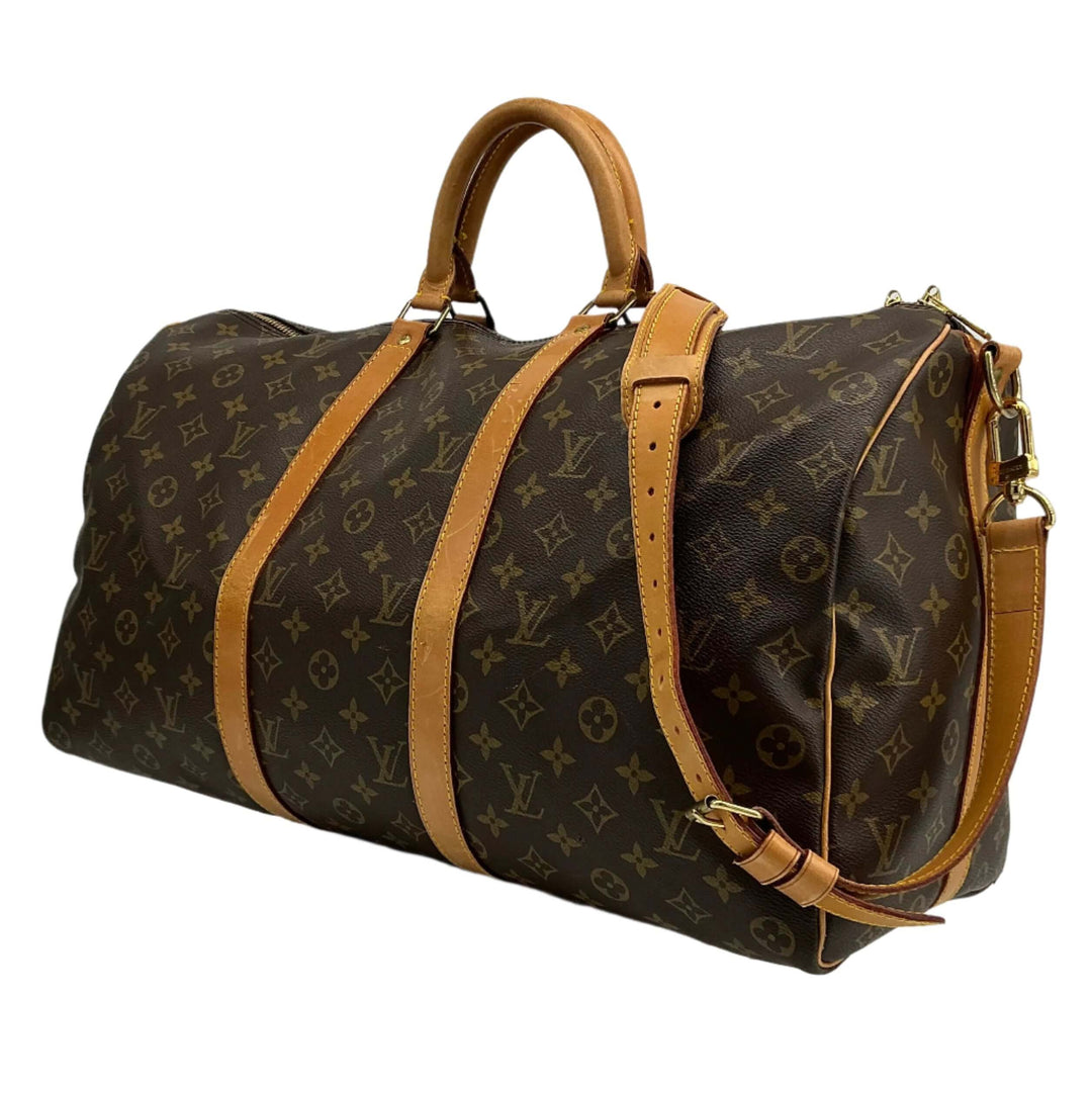 Louis Vuitton Keepall Bandouliere 50 travel duffel bag in monogram canvas with leather accents.