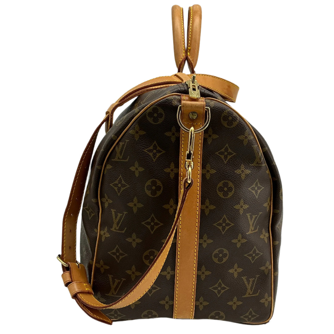 Louis Vuitton Keepall Bandouliere 50 monogram canvas travel duffel bag side view with leather accents.