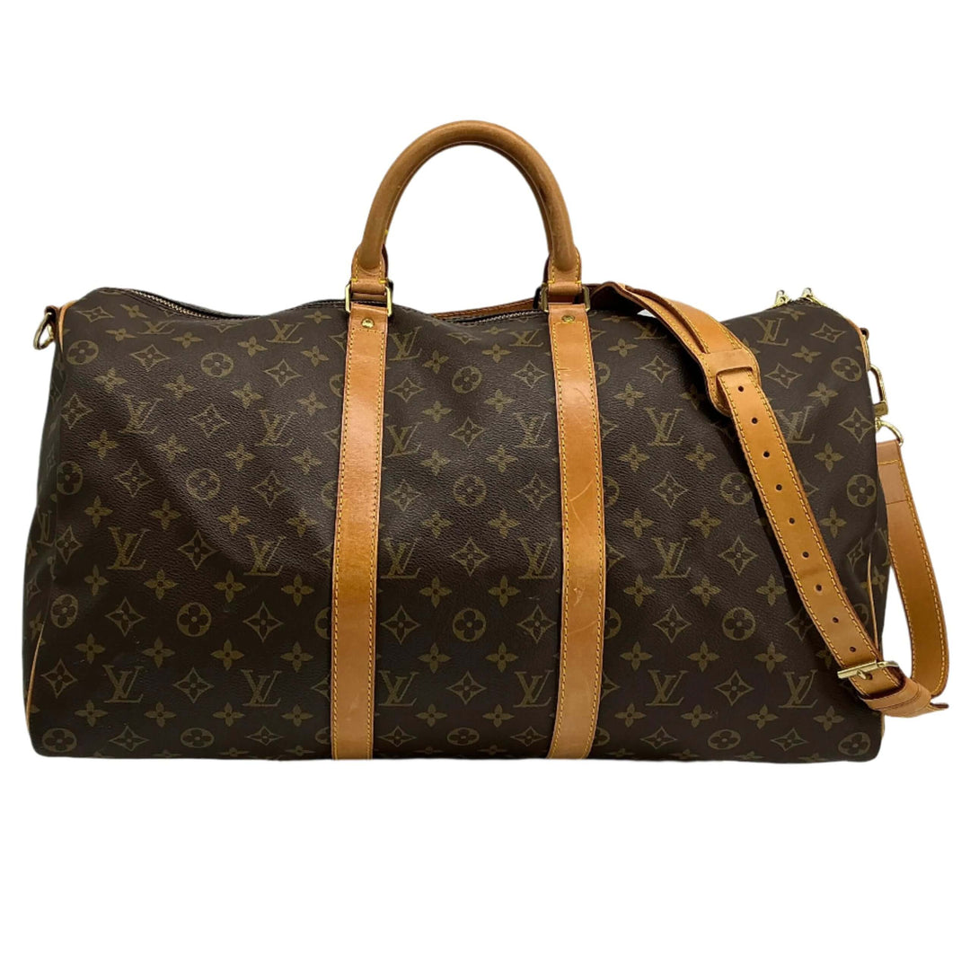 Louis Vuitton Keepall Bandouliere 50 travel duffel bag in monogram canvas with leather accents.