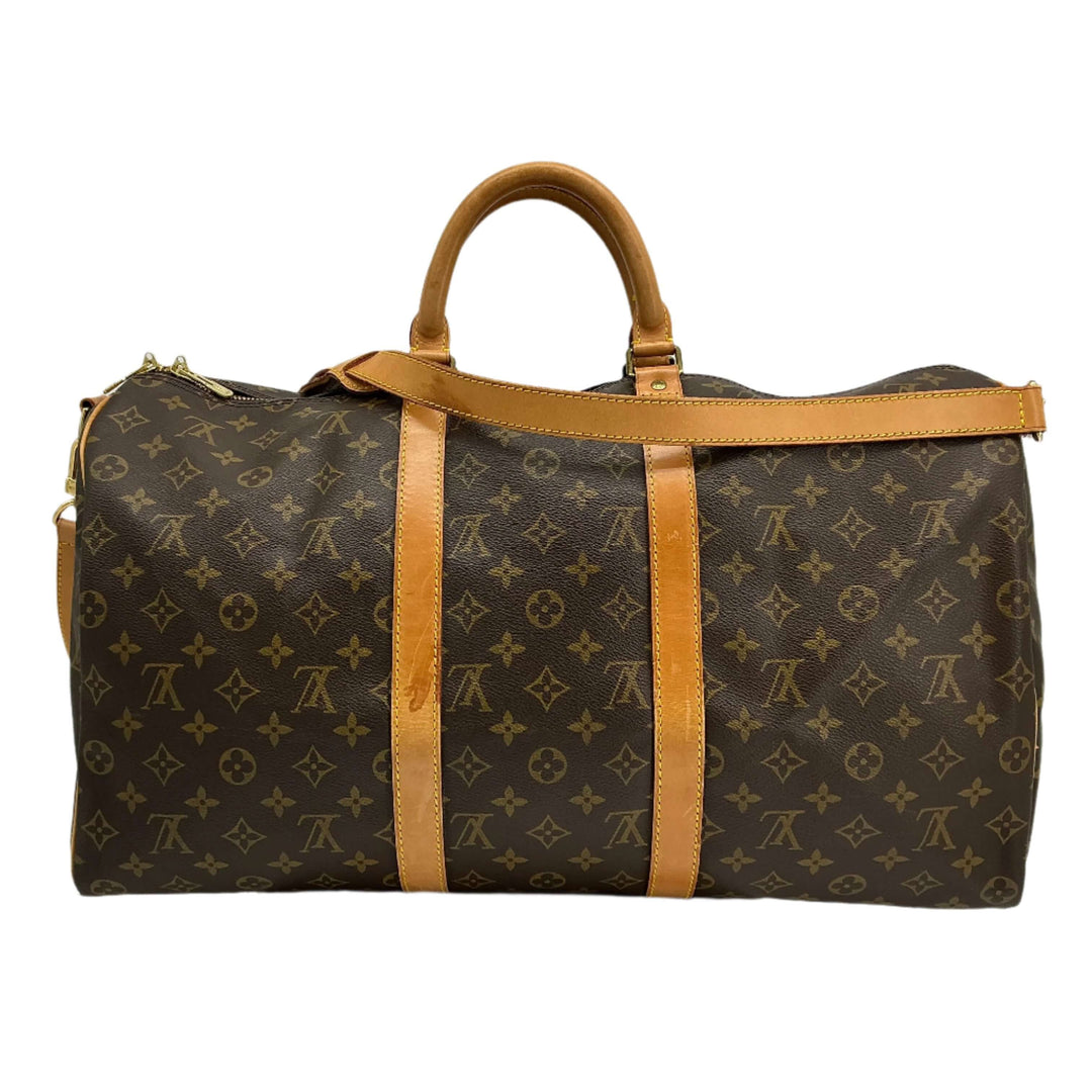 Louis Vuitton Keepall Bandouliere 50 travel duffel bag in monogram canvas with vachetta leather accents.