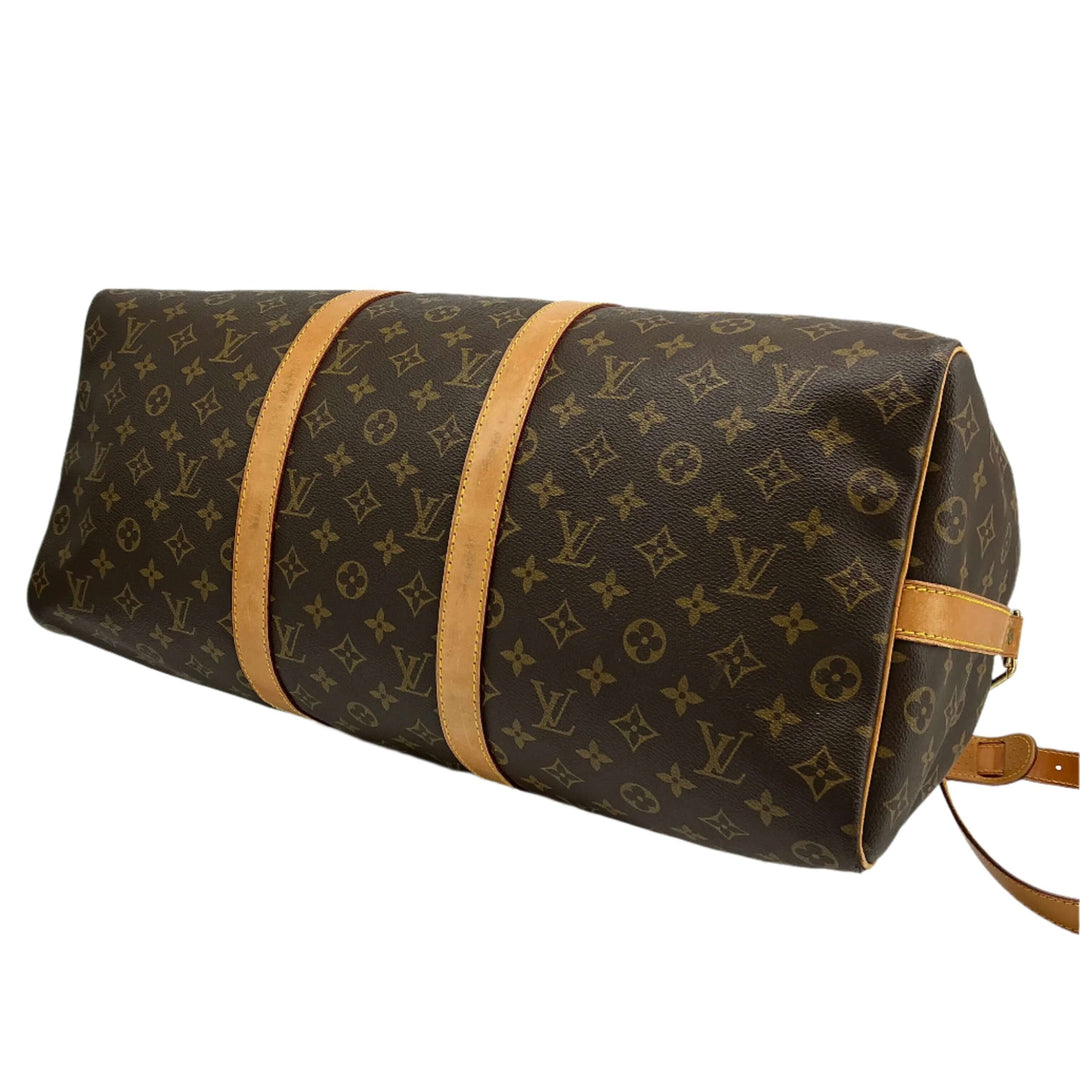 Louis Vuitton Keepall Bandouliere 50 travel duffel bag in monogram canvas with vachetta leather accents.