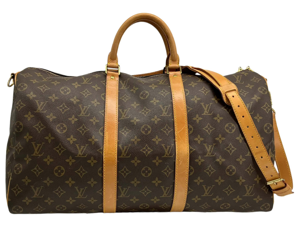 Louis Vuitton Keepall Bandouliere 50 travel duffel bag in monogram canvas with leather straps.