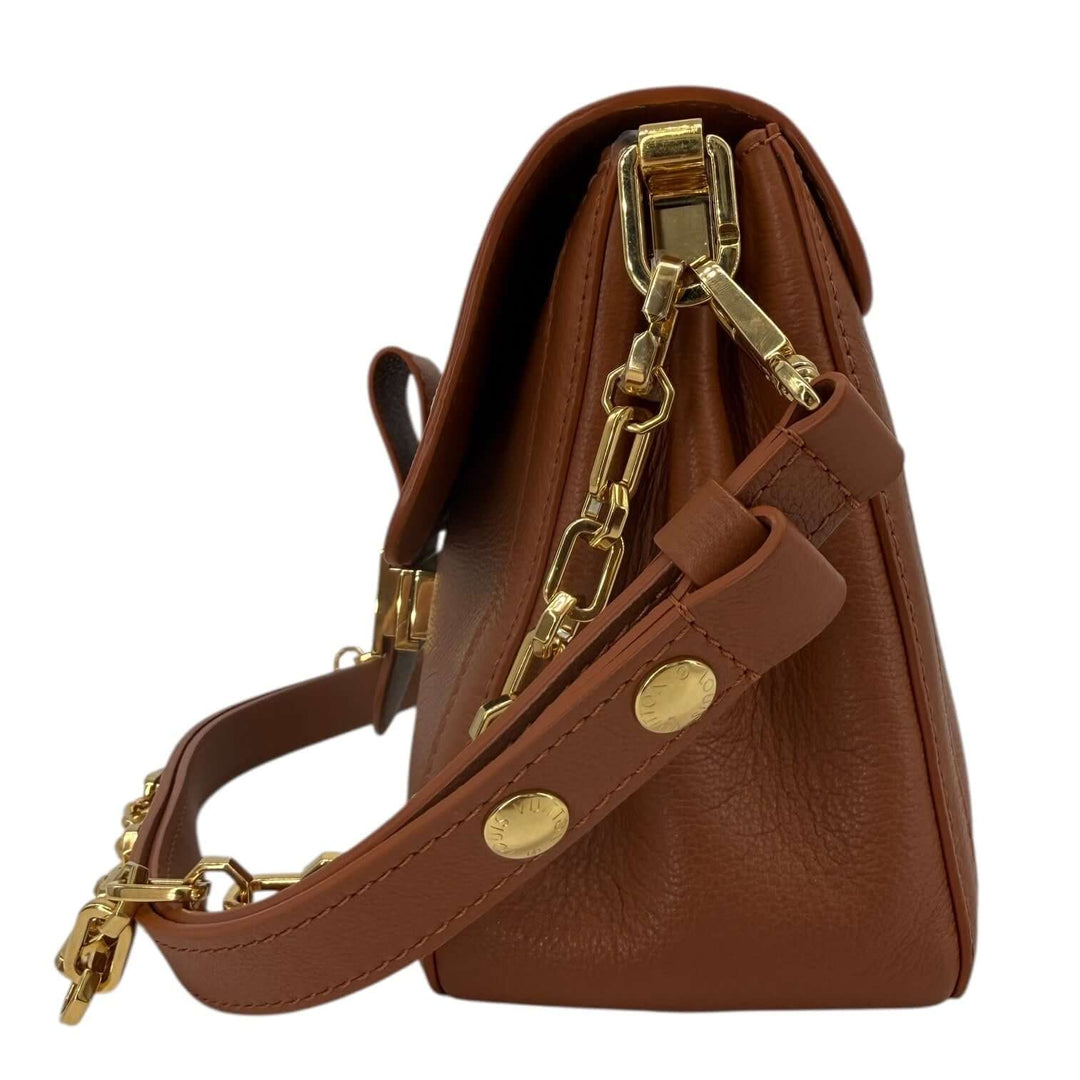 Louis Vuitton Leather Shoulder Bag with LV Turn-Lock Chain Strap Brown side view showcasing the gold-tone chain strap.