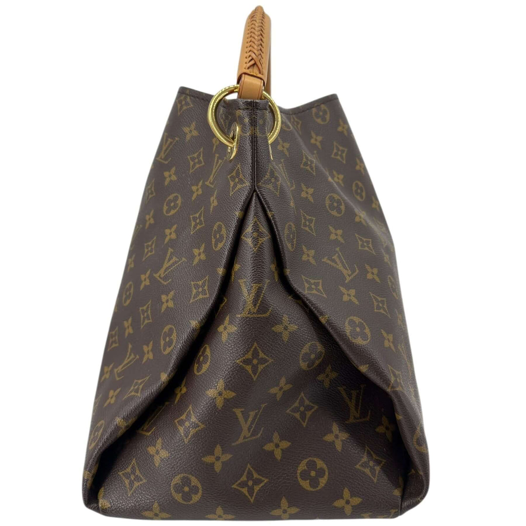 Louis Vuitton Monogram Artsy MM Shoulder Bag Brown showcasing the brown Monogram toile coated canvas and braided top handle.