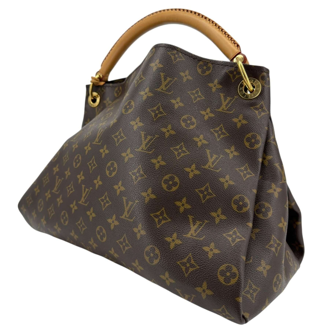 Louis Vuitton Monogram Artsy MM Shoulder Bag Brown side view with vachetta handle and gold-tone hardware.