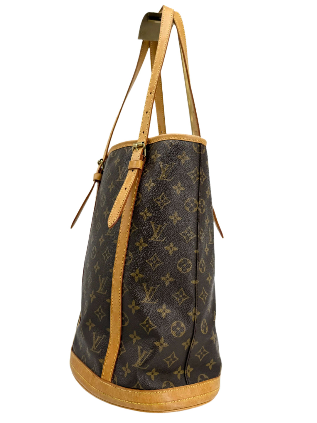 Louis Vuitton Monogram Bucket Bag side view showcasing coated canvas and natural leather trim.