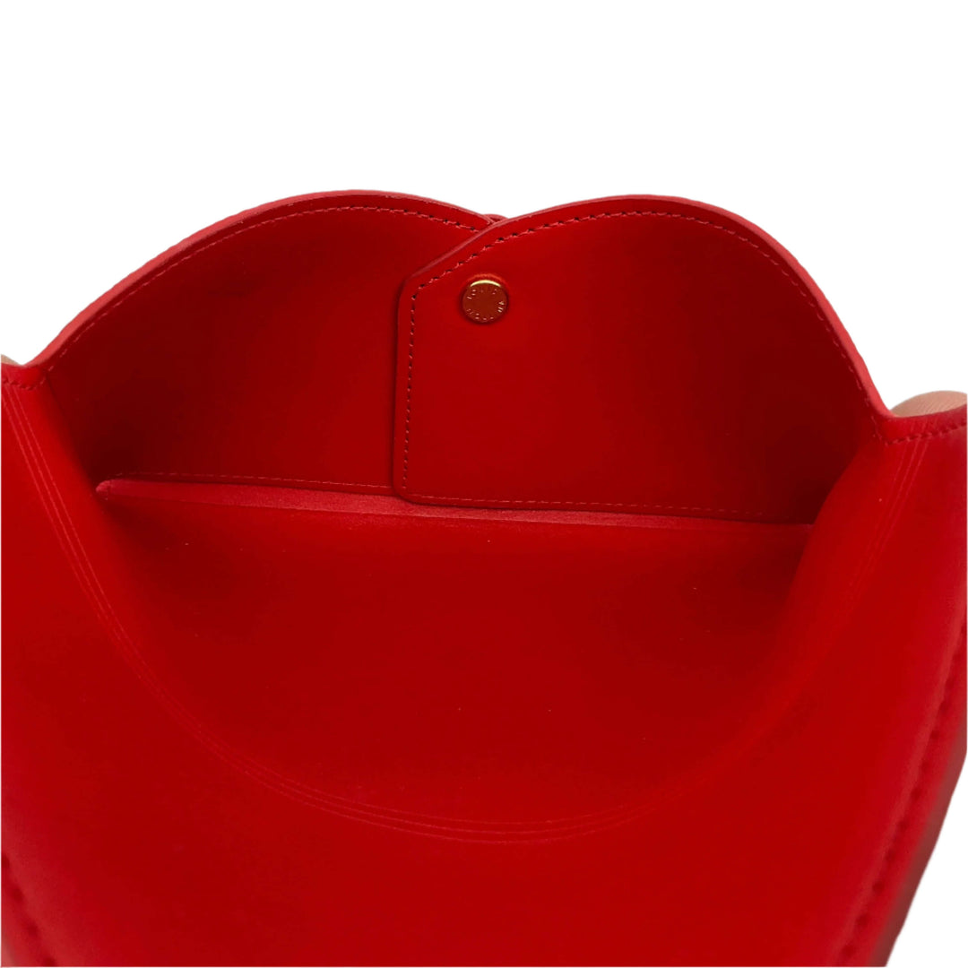 Inside view of the red Louis Vuitton Monogram Medium Kirigami Pochette Insert showcasing storage compartment.
