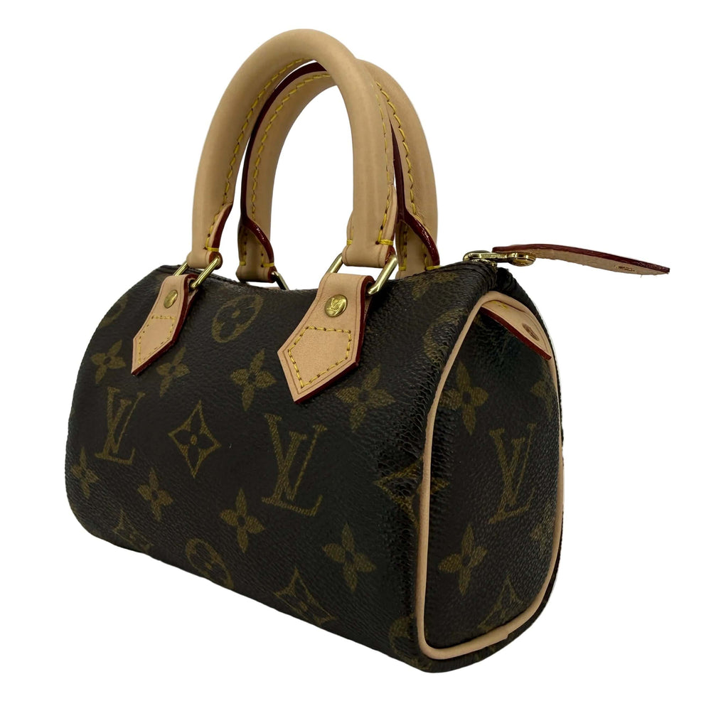 Louis Vuitton Mini HL Speedy handbag with refreshed Vachetta leather and iconic Monogram pattern.