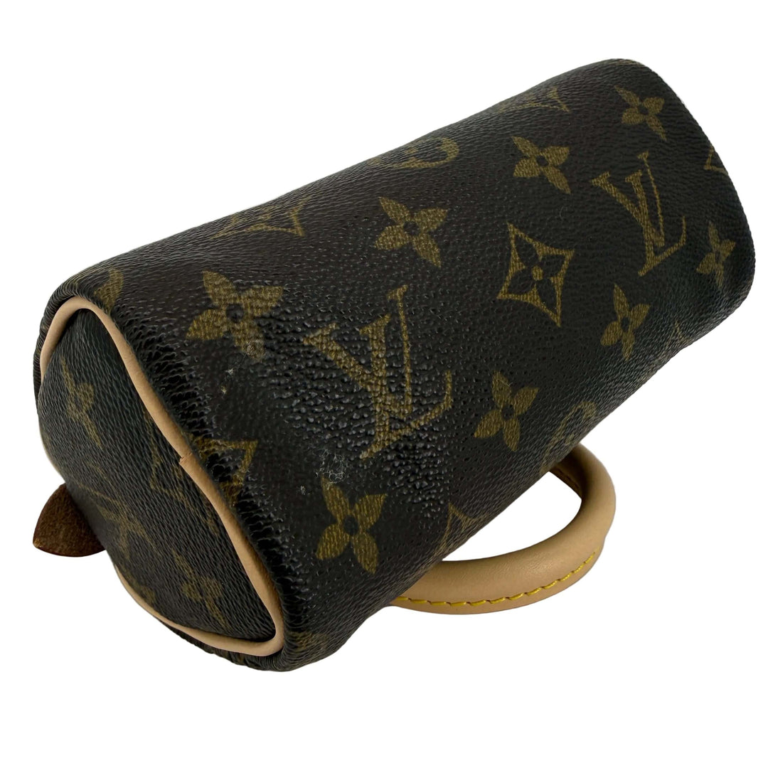 Louis Vuitton Mini HL Speedy handbag with Monogram coated canvas and refreshed Vachetta leather, showing stylish design.