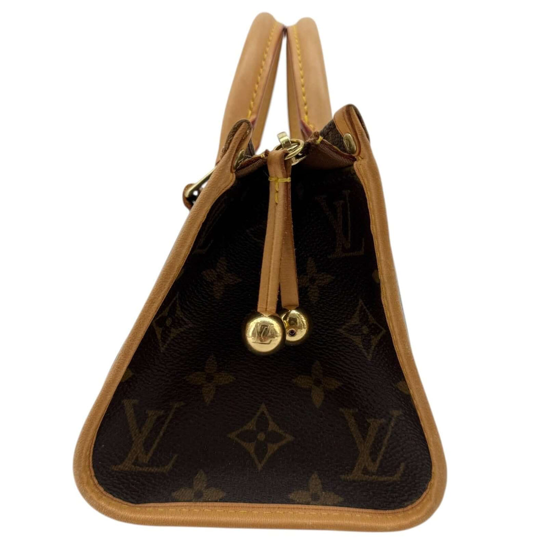 Louis Vuitton Monogram Popincourt Top Handle Handbag, view of the top with rolled handles and gold-tone hardware.