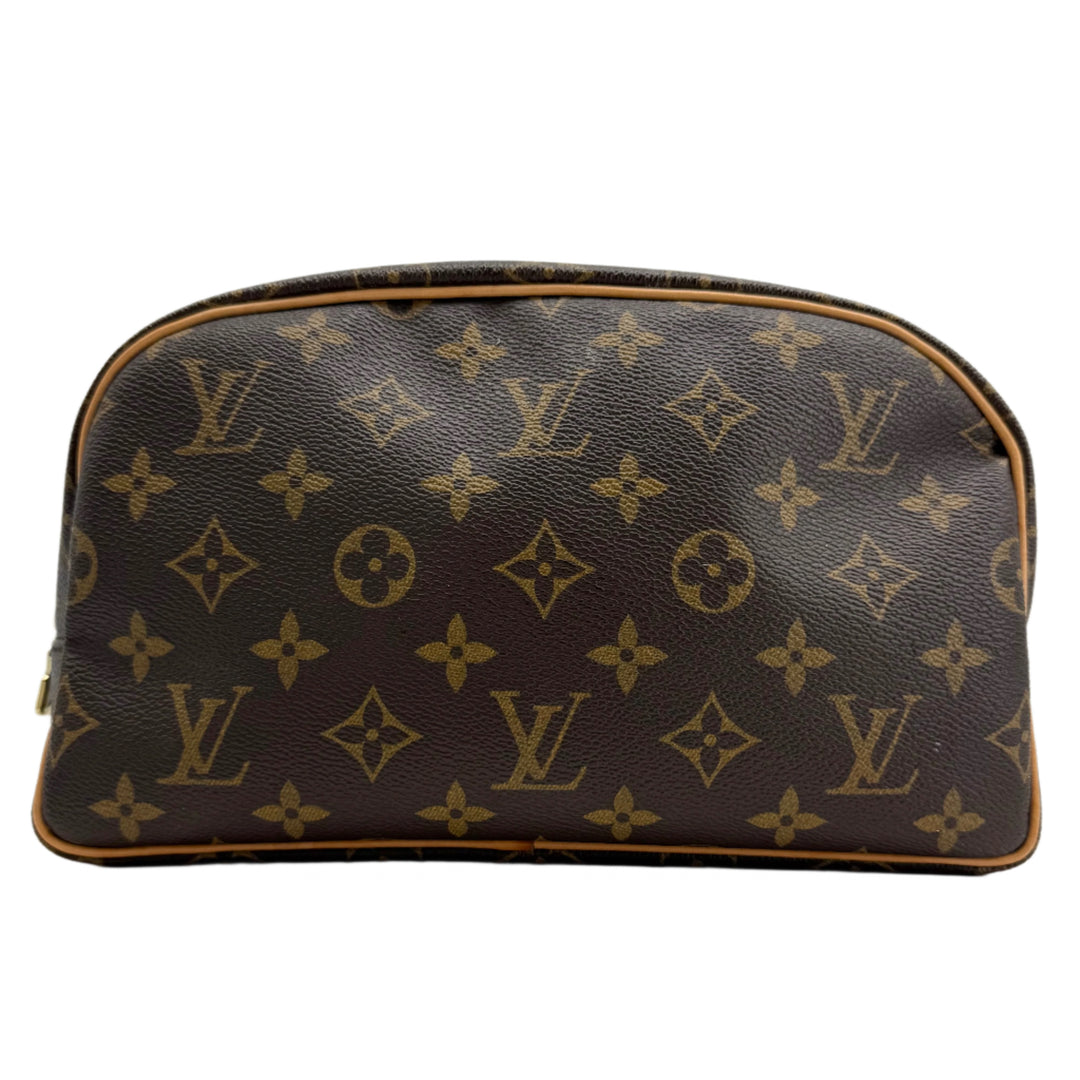 Louis Vuitton Monogram Toiletry Bag 25 – classic canvas travel case with vachetta leather trim and gold-tone zipper.