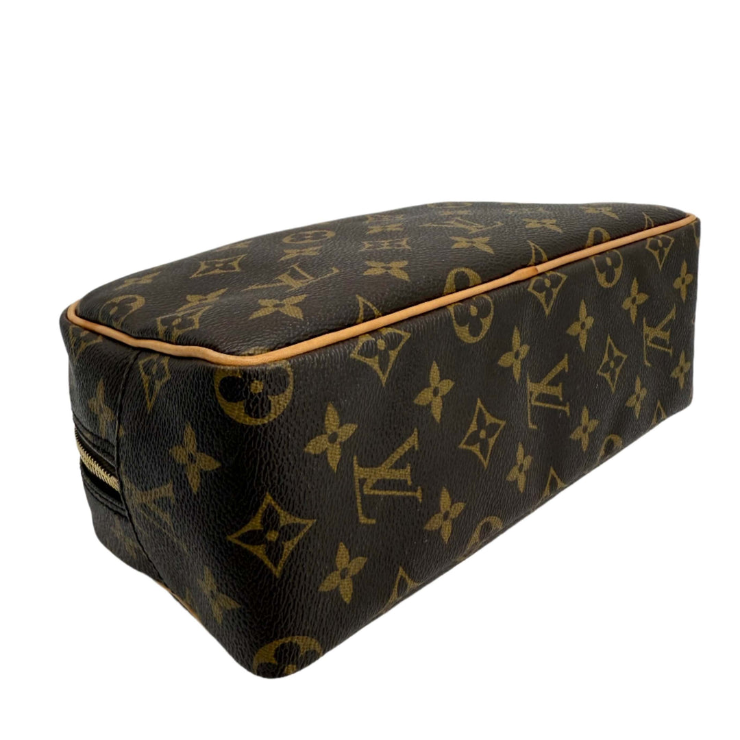 Louis Vuitton monogram toiletry bag 25 in classic canvas, showcasing iconic design and structured storage for travel.