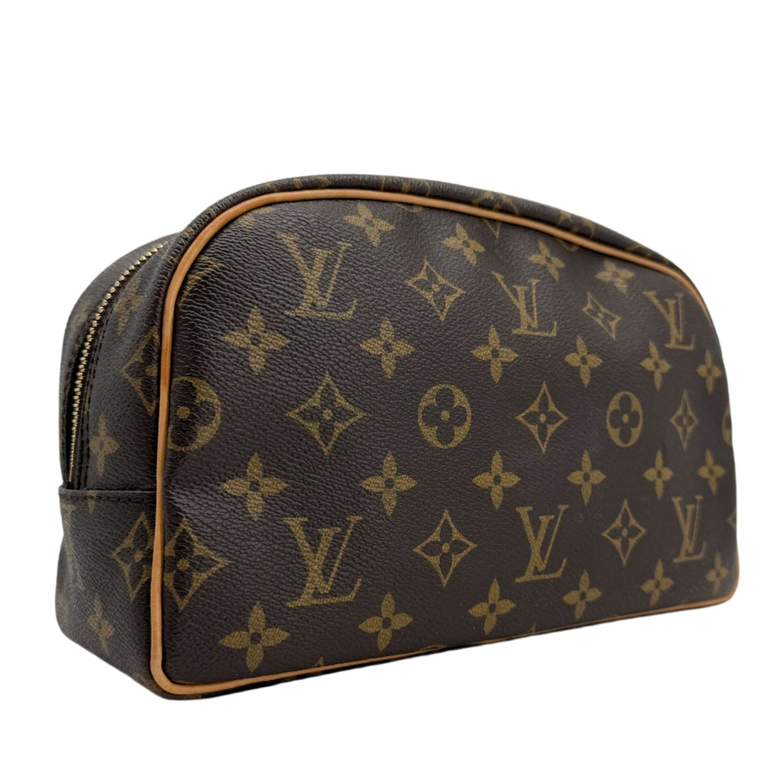 Louis Vuitton Monogram Toiletry Bag 25 in classic canvas, featuring iconic design and vachetta leather trim.