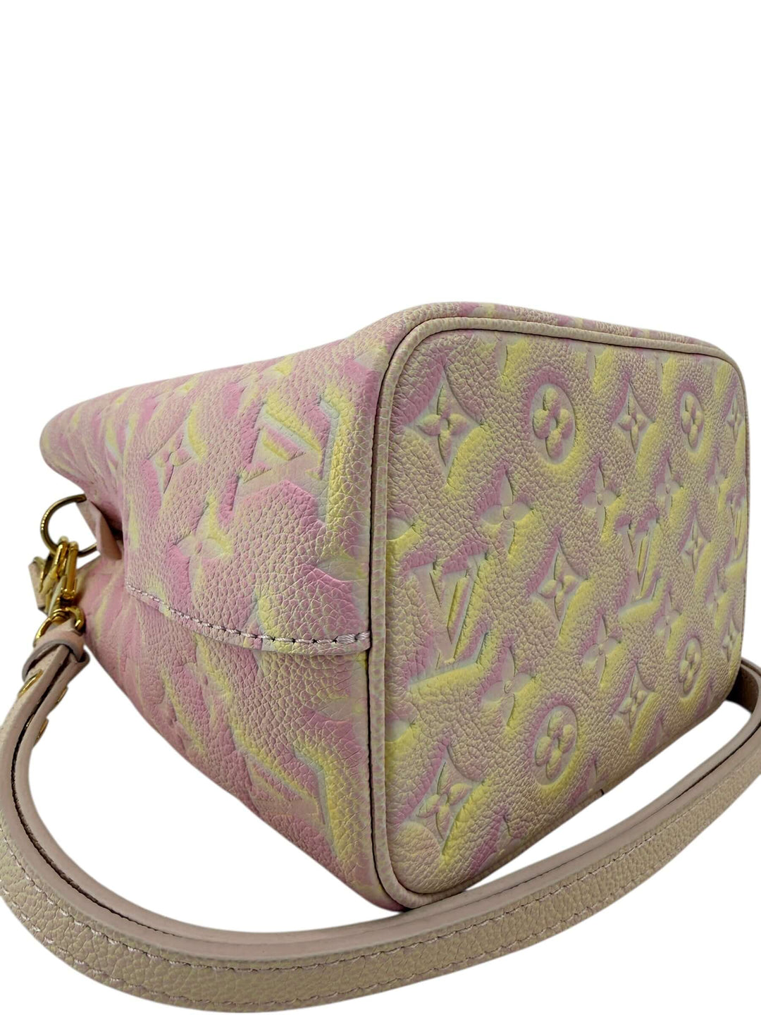 Louis Vuitton Empreinte Monogram Summer Stardust Néonoé BB Bucket Bag Pink in pink yellow cream spray finish with gold tone hardware.