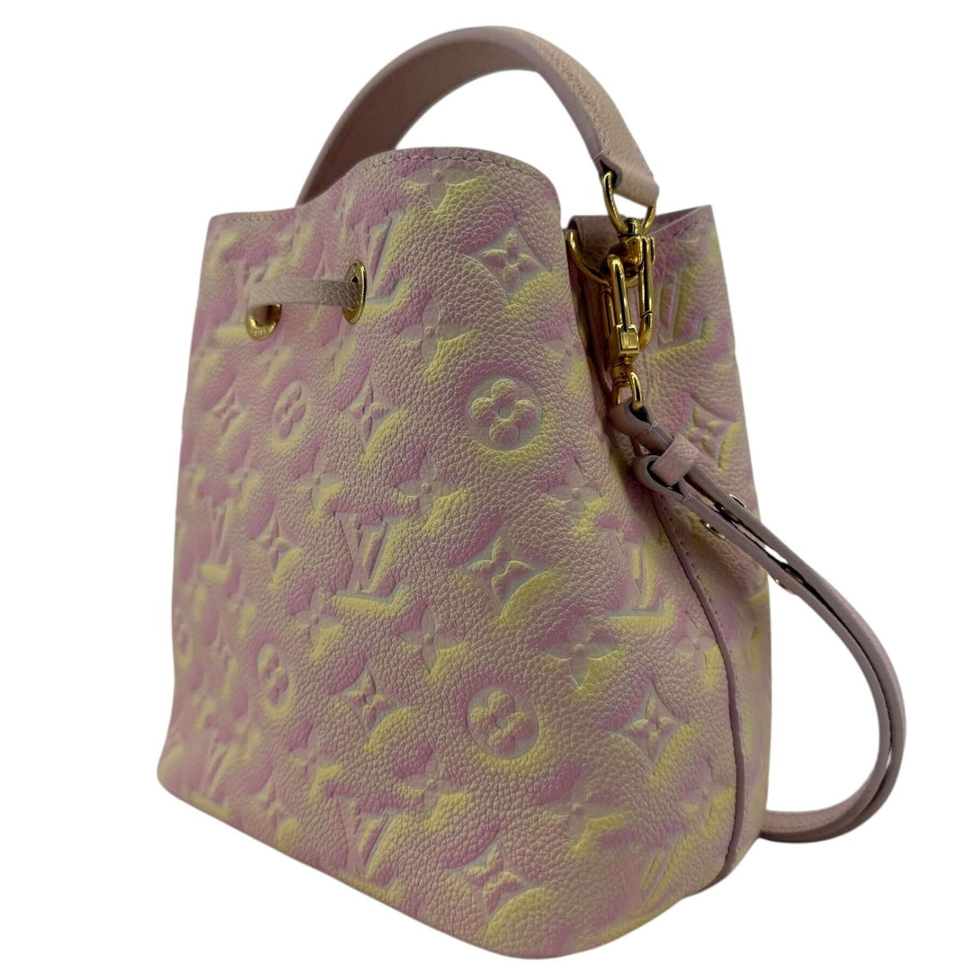 Louis Vuitton Empreinte Monogram Summer Stardust Néonoé BB Bucket Bag Pink in embossed calf leather with pink yellow cream finish and gold tone hardware.