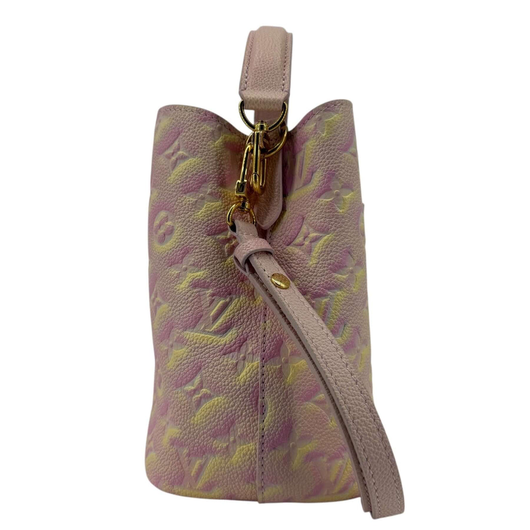 Louis Vuitton Empreinte Monogram Summer Stardust Néonoé BB Bucket Bag Pink with adjustable leather strap and gold tone hardware.