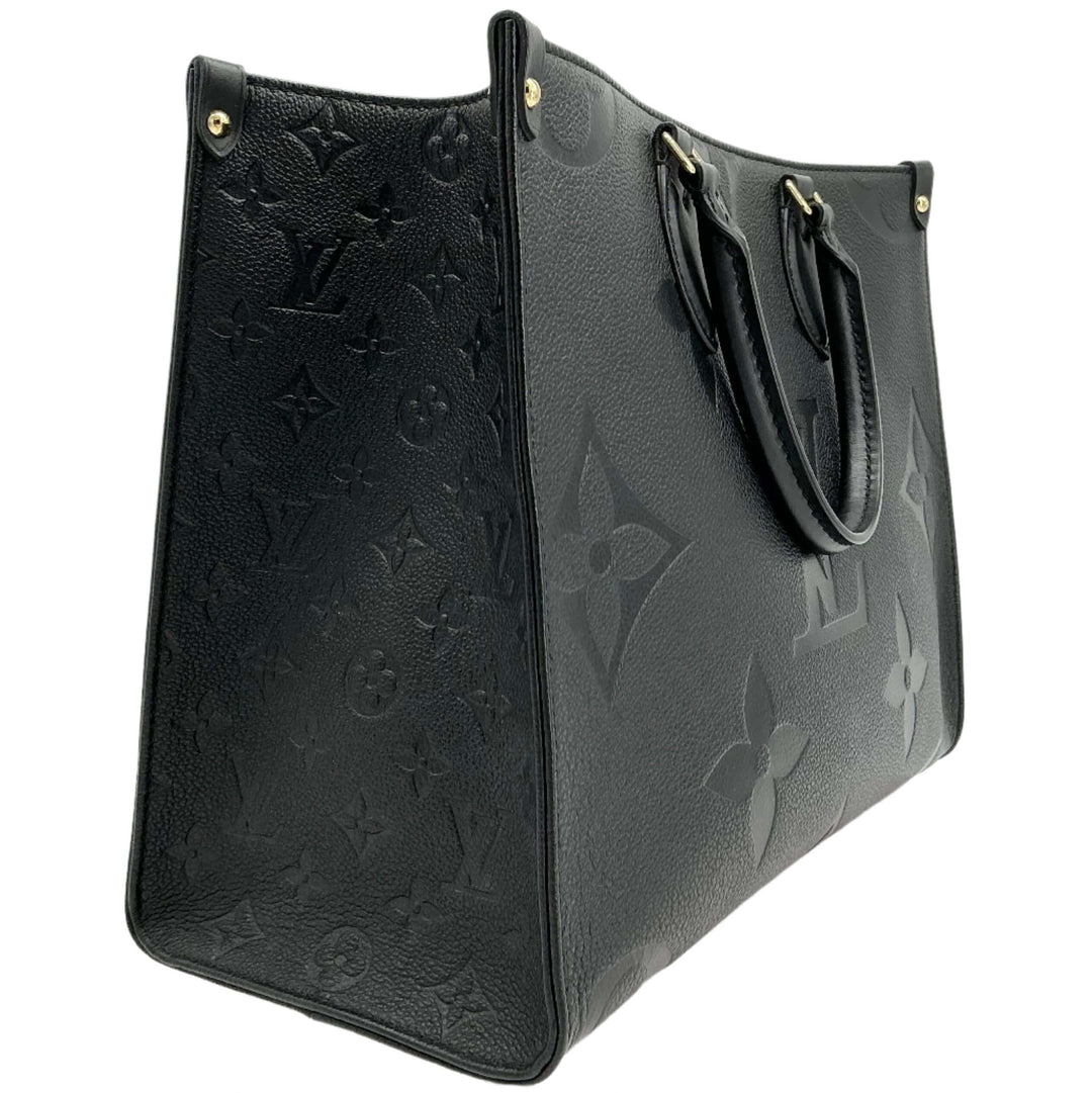 Louis Vuitton Onthego MM Tote Bag in black Monogram Empreinte leather, showcasing its elegant design and spacious silhouette.