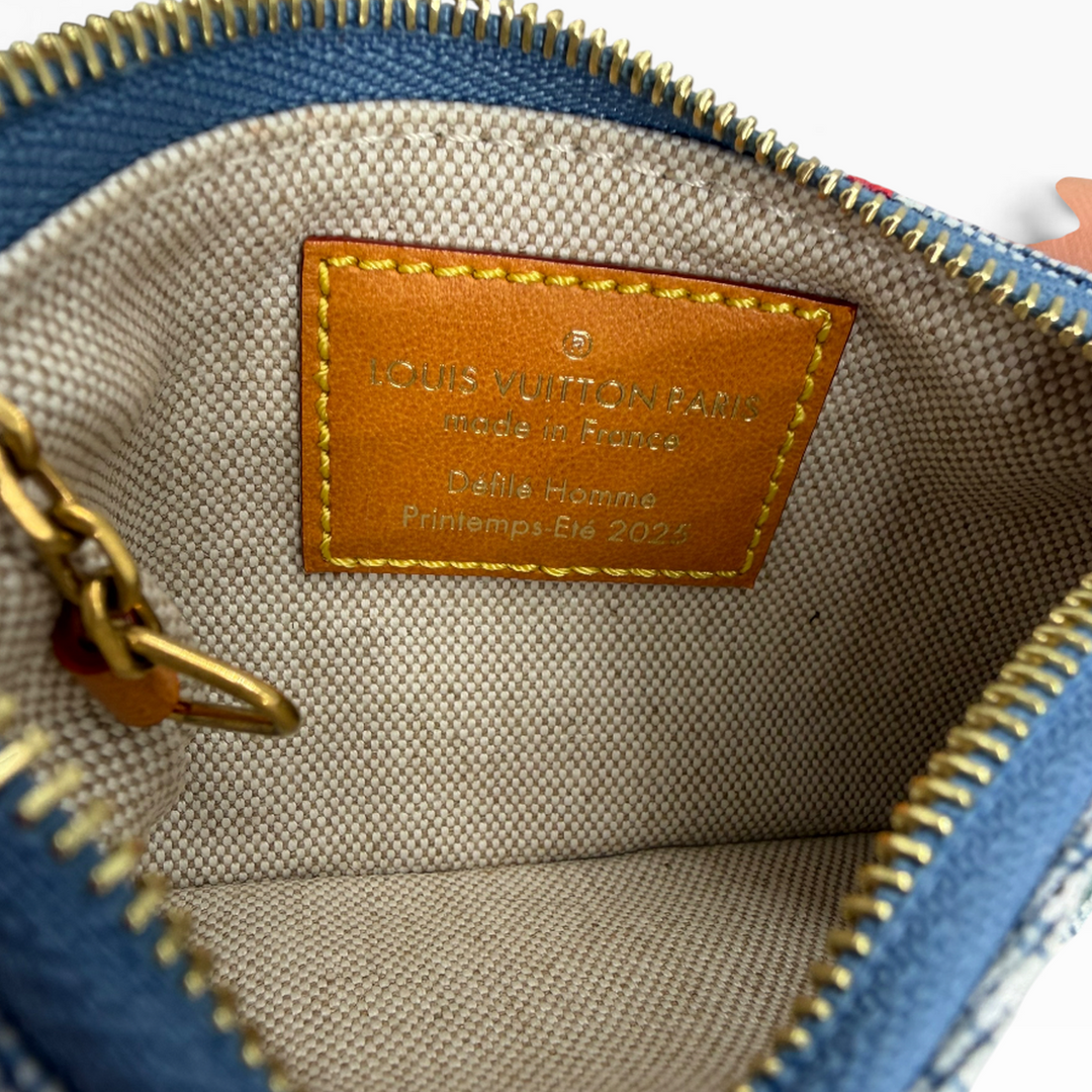 Inside Louis Vuitton LVers Damier denim pouch showing textile lining and Made in France label for Spring Summer 2024
