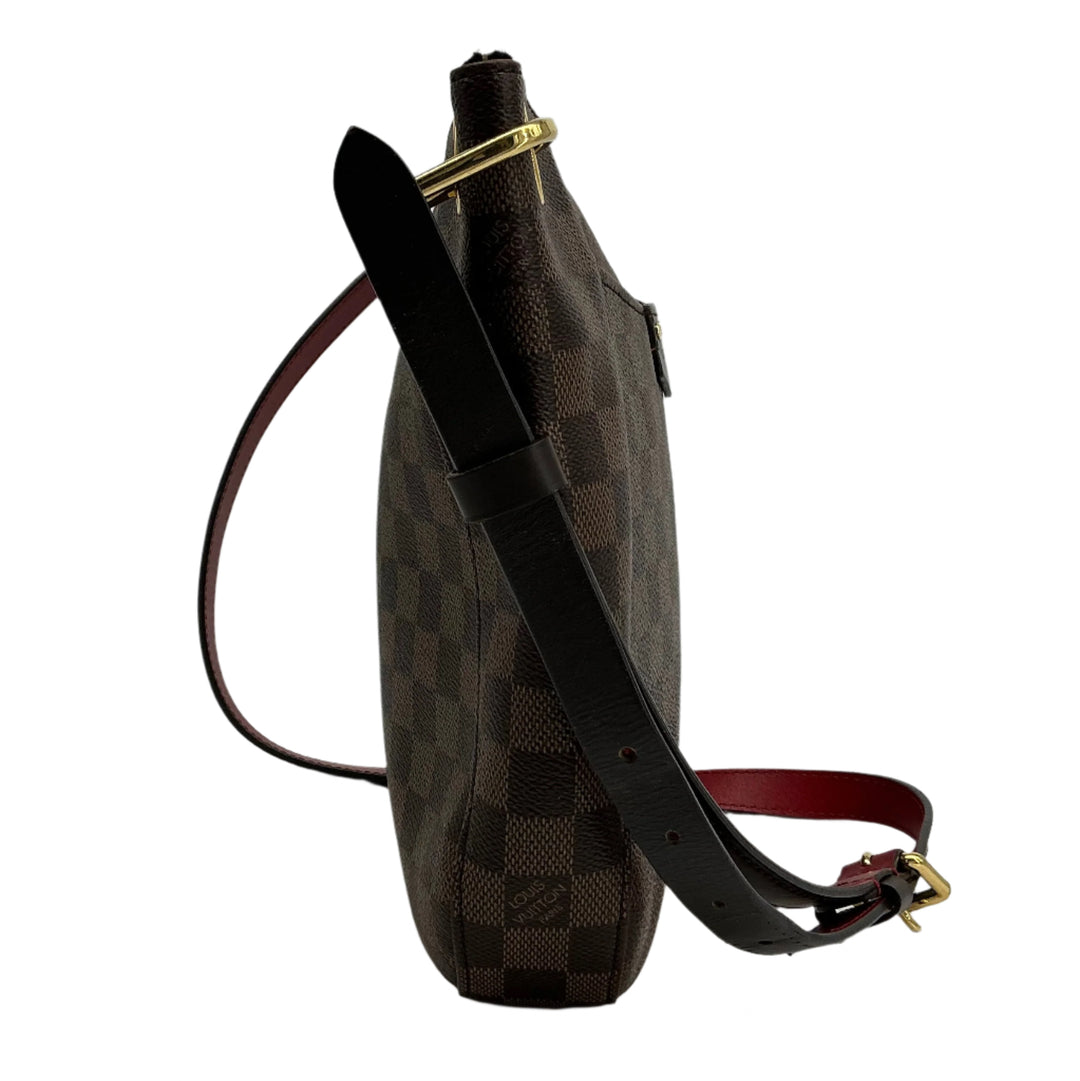 Side view of the Louis Vuitton South Bank Besace shoulder bag featuring Damier Ebene canvas and a stylish strap.