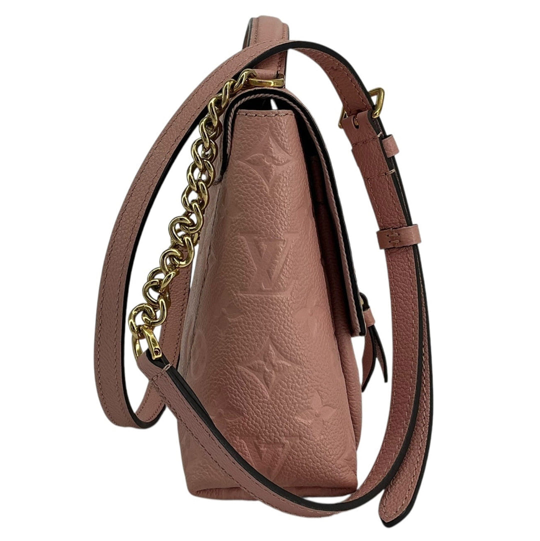 Side profile of Louis Vuitton Blanche BB Monogram Empreinte bag