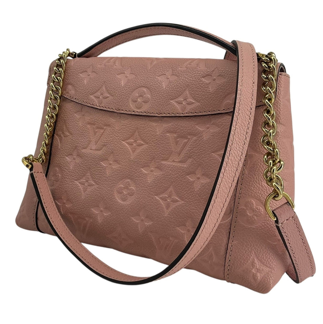 A pink Louis Vuitton monogram shoulder bag with a top handle, gold chain strap, and black trim, shown against a plain white background.