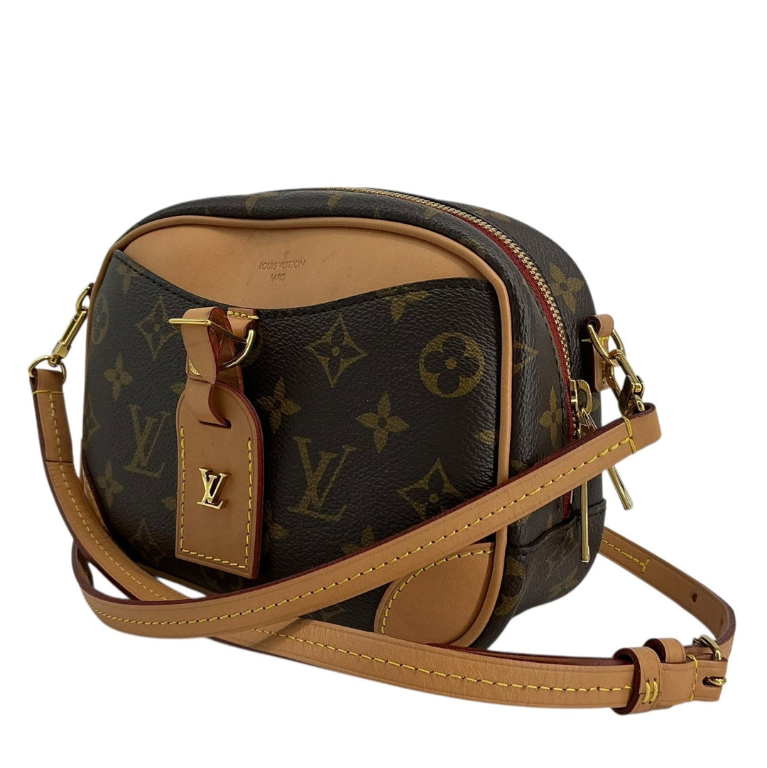 Louis Vuitton Monogram Deauville Mini front angle with luggage tag and gold hardware