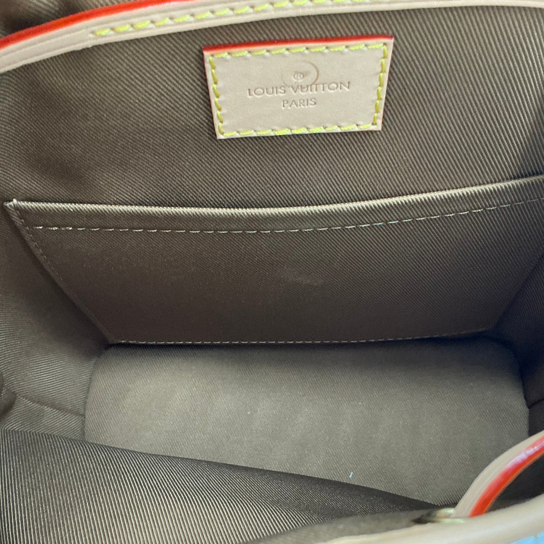 Louis Vuitton Montsouris PM brown textile interior and slip pocket