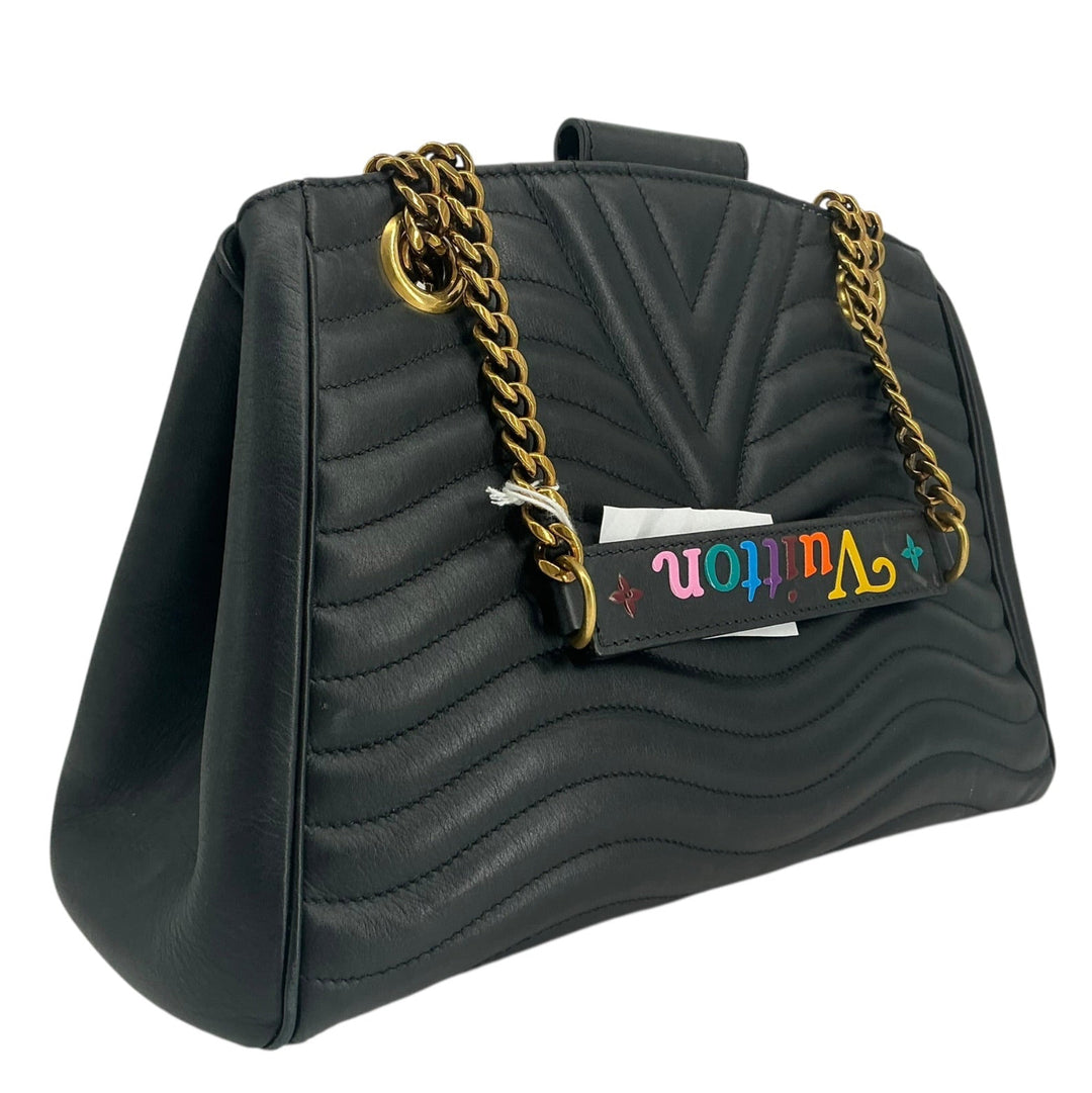 Angled reverse view of Louis Vuitton New Wave Chain Tot