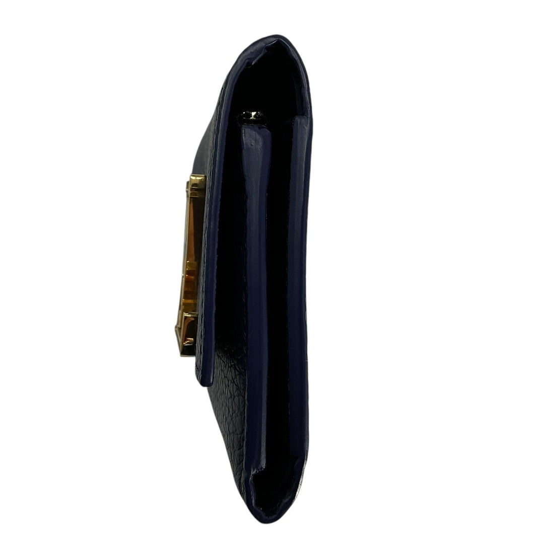 Right side profile of Louis Vuitton Capucines Compact navy wallet
