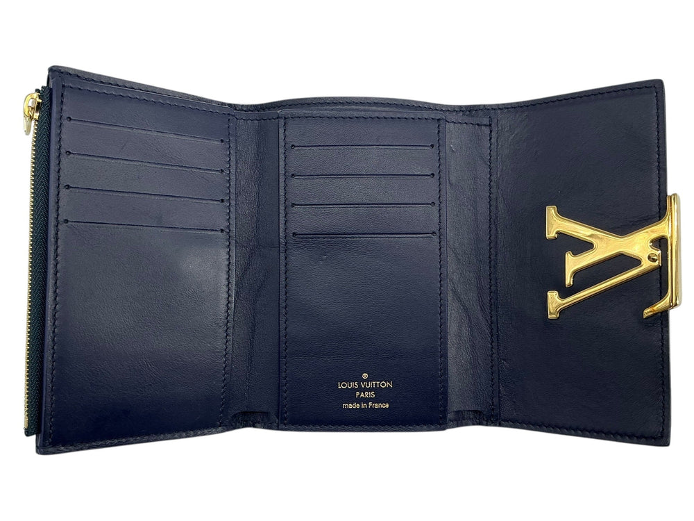Louis Vuitton Capucines Compact navy wallet interior with card slots and zip pocket
