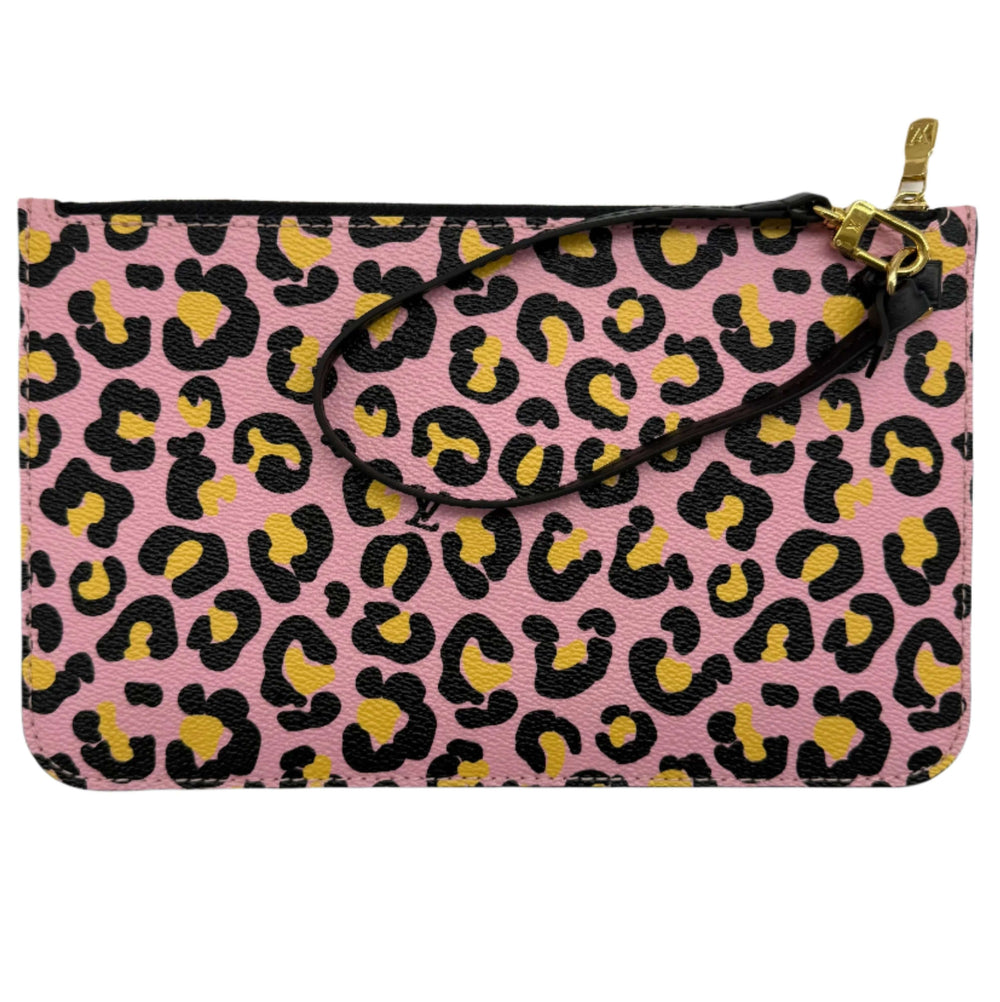 Pink leather clutch featuring leopard print in black and yellow with a wrist strap.